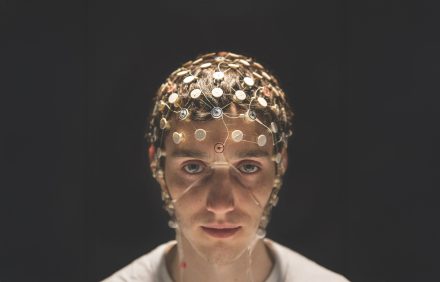 Man with electrodes on head